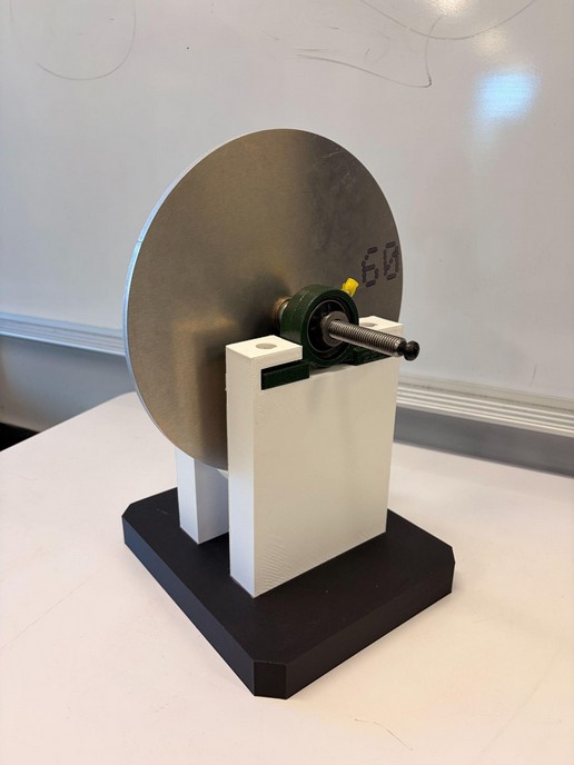 Completed eddy-current braking prototype with aluminum rotor and electromagnet mounts